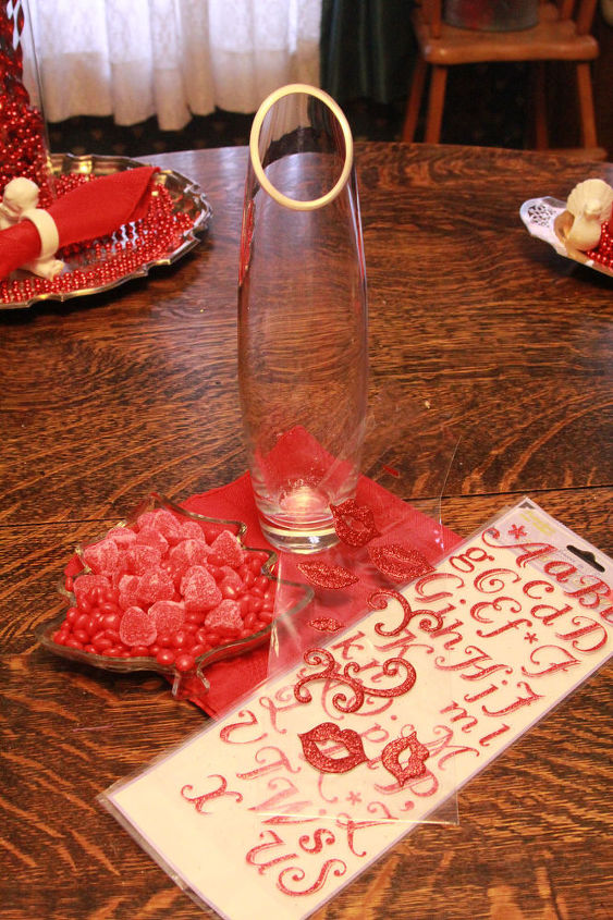 valentine s day thrift store to romance, christmas decorations, seasonal holiday d cor, valentines day ideas, Cinnamon and candy hearts thrift store glass bottle table napkin dollar store letters Christmas beads thrift store mirrored tray and embellishments