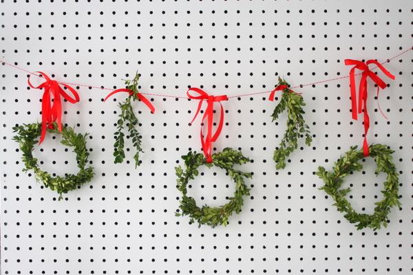 diy boxwood mini wreaths, crafts, seasonal holiday decor, 6 To make a festive garland make several wreaths and tie them to red and white baker s twine