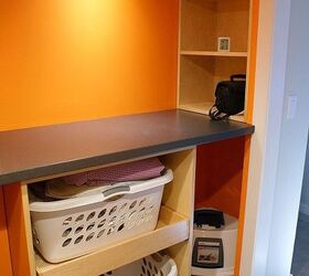 a functional laundry room, This is the folding station and storage You can also find a place for the cats litter box in here