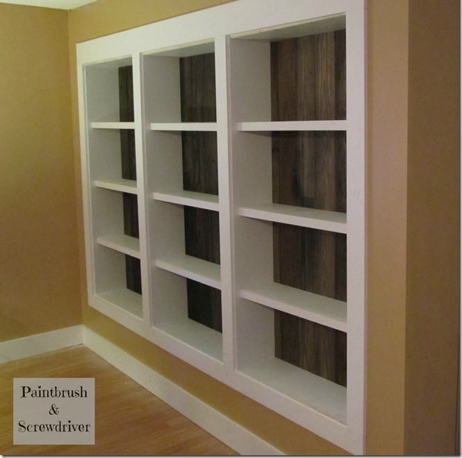 built in bookcases featuring re claimed pine flooring, home decor, shelving ideas, storage ideas, We built the side panels and shelves with pre primed lumber and added the re claimed pine flooring for the back