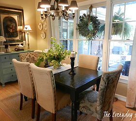 breakfast room, home decor, living room ideas, painted furniture, Black Painted Farmhouse Table a mixture of khaki parson s chairs with two paisley parson s chairs on each end A cute blue cabinet anchors a large print on one side