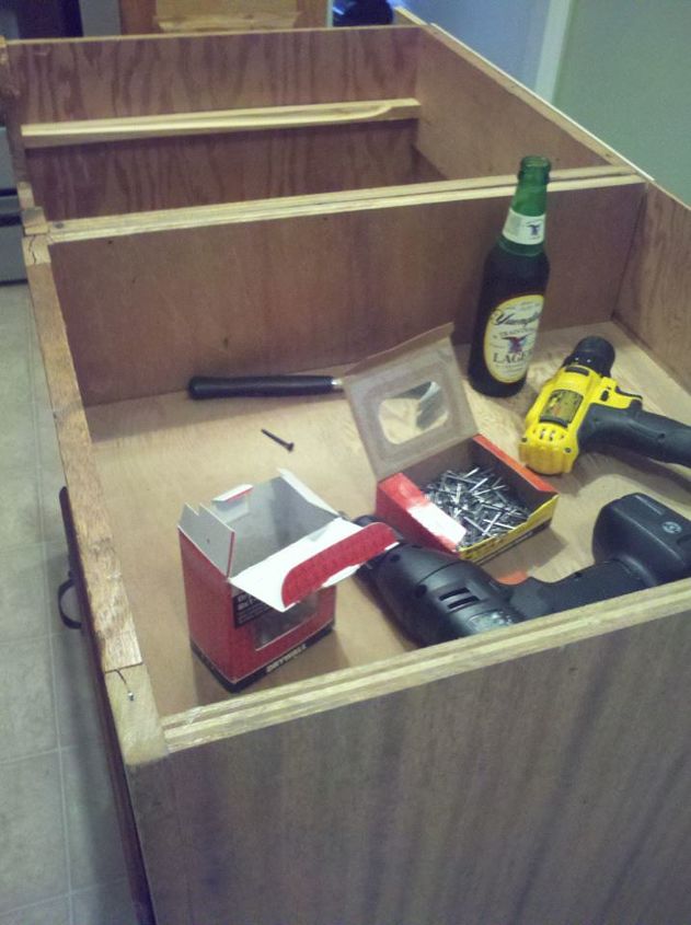 old base cabinets repurposed to kitchen island, The Yuengling was an essential tool