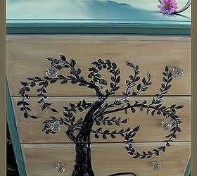 laminate furniture can be beautiful too hand painted willow dresser, painted furniture, after painting the tree I outlined the whole tree in my metallic Krink permanent paint pen I distressed the whole thing by lightly sanding and then used a light wax to seal the finish When it was dry I buffed the whole thing