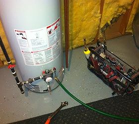 water heater maintenance, home maintenance repairs, plumbing, This water heater has a brass floor drain the can be opened with with a screw driver