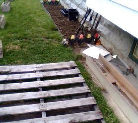 cinder block gardening, gardening, I will place composting bins under the window over hang as place potted tomato plants on the pallets
