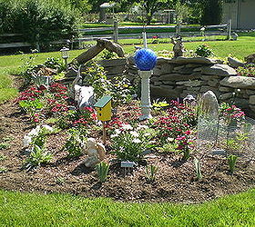 flower beds, flowers, gardening, I wanted a mound in the yard The neighbors were taking grass out so we had it put in our yard I cleaned it up and dug flower bed in front and one in next picture Used grass for instsnt grass on top of mound rock in front