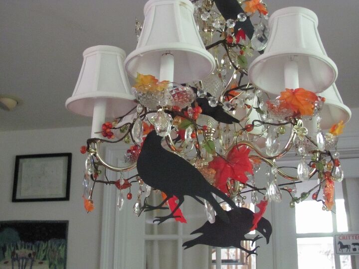 black crows autumn decorating, seasonal holiday decor, I decorated my chandelier with fake autumn leaves and then added the black crows Love em It makes the chandelier look alive with birds