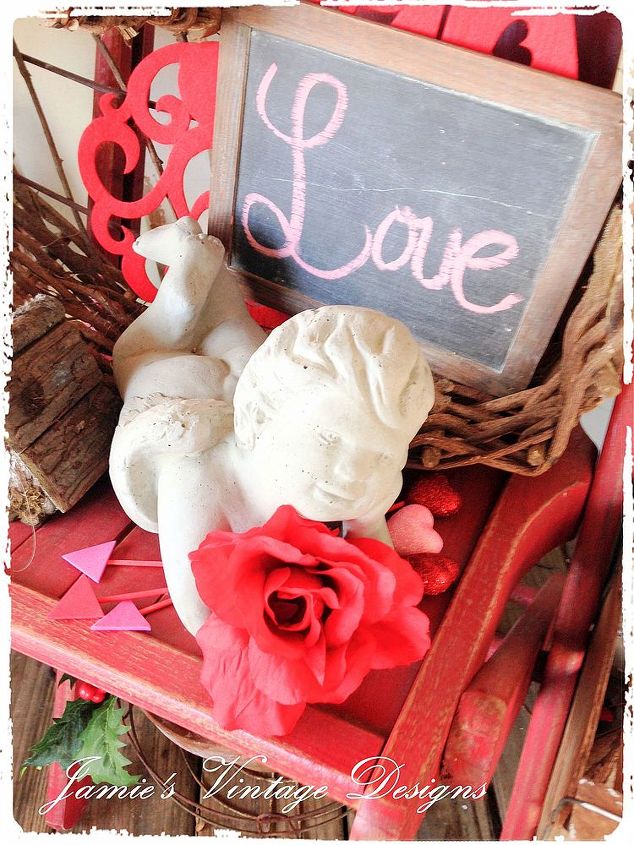 valentine s day porch, home decor, porches, seasonal holiday decor, valentines day ideas, My Cupid I used floral heart picks and glued foam shaped triangles to the bottom of the picks to make arrows for my garden angel