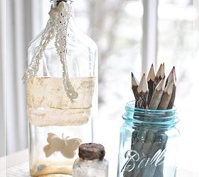 how to create an entryway when you don t have one, foyer, home decor, A few old bottles adorn the desk one with twig type pencils