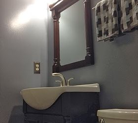 diy bathroom renovation, bathroom ideas, home improvement, painting, This photo shows the new paint choices light fixture vanity mirror vanity plus sink faucet towel rack and toilet Everything was completed by my husband and myself