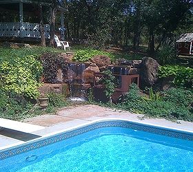 antique car pondless waterfall, landscape, outdoor living, ponds water features, repurposing upcycling, This pondless waterfall is a great backdrop for the swimming pool