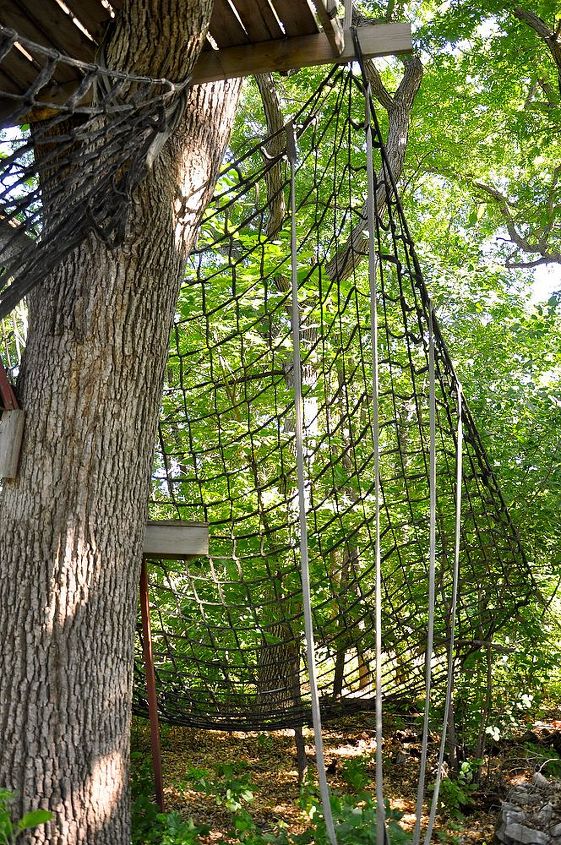 inexpensive alternative to playground equipment, outdoor living, We tied the other end of the second net to the tree just below the tree house This created a climbing wall if you will to the tree house and the kid catcher