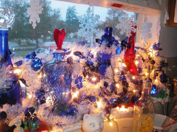my memory christmas angel tree, christmas decorations, seasonal holiday decor, My kitchen window with my collection on bottles