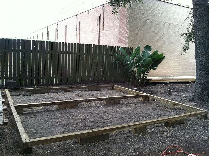 backyard deck in new orleans, decks, diy, gardening, outdoor living, urban living, woodworking projects, Frame 6x4 inch posts to raise deck off the ground 4x4 inch 16 foot framing beams Cut ends at 45 degree angle to set square frame