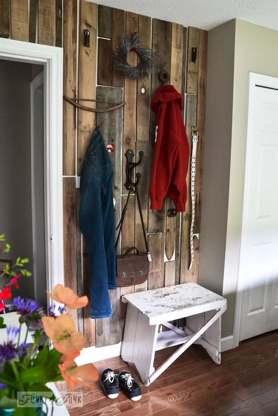decorating from nothing to something a junker s full home tour, home decor, outdoor living, repurposing upcycling, A feature wall made out of pallet wood was flipped into something ultra productive by adding a few hooks
