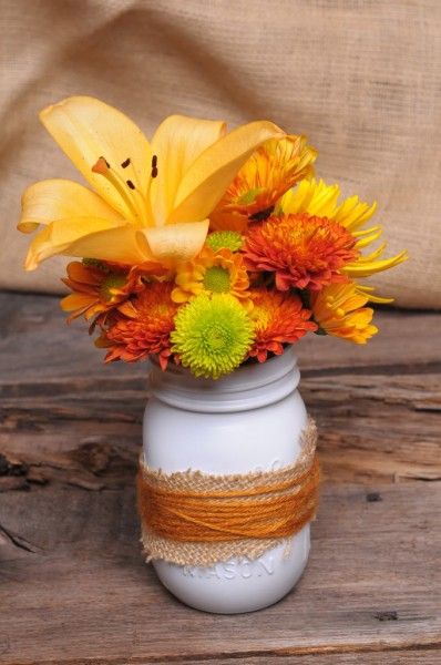 budget friendly fall decor, crafts, mason jars, outdoor living, seasonal holiday decor, wreaths, Everyone has mason jars burlap and spray paint laying around now a days Might as well combine them with the colorful flowers in the garden for fall inspired centerpieces when guests are coming by