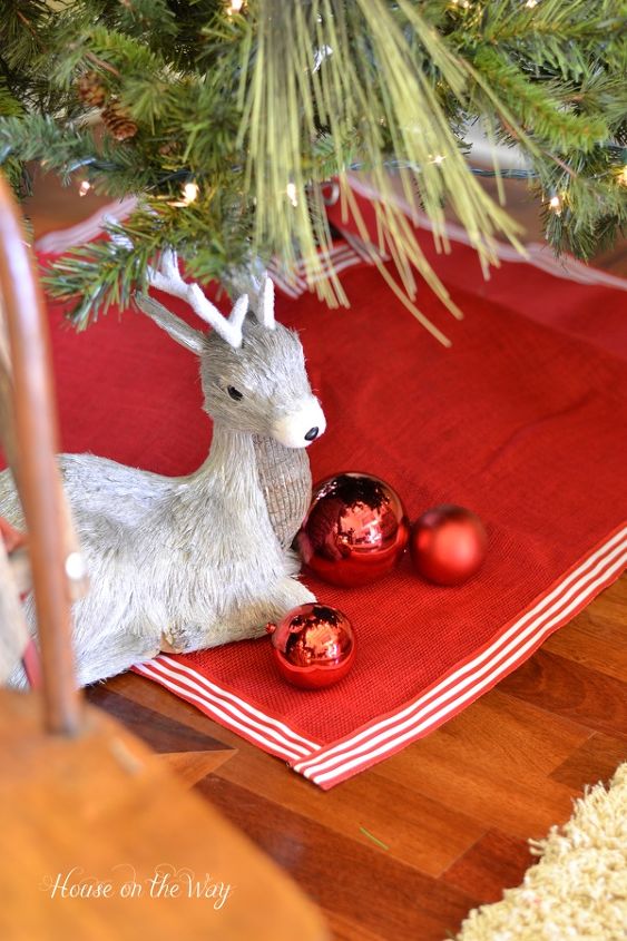 how to make an easy christmas tree skirt, crafts, seasonal holiday decor, Red Burlap Christmas Tree Skirt with Ribbon Trim