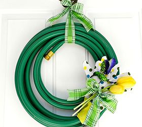 garden hose wreath, crafts, repurposing upcycling, wreaths, The ribbon not only held the wreath up on 1 nail on my door it held the gloves humming bird and tulips in place