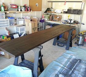 craft room work area table counter top, diy, how to, painted furniture, woodworking projects, Stained with a mahogany tone of Minwax This color was really dark so by the time I painted the entire board length I was able to go back and start wiping it down
