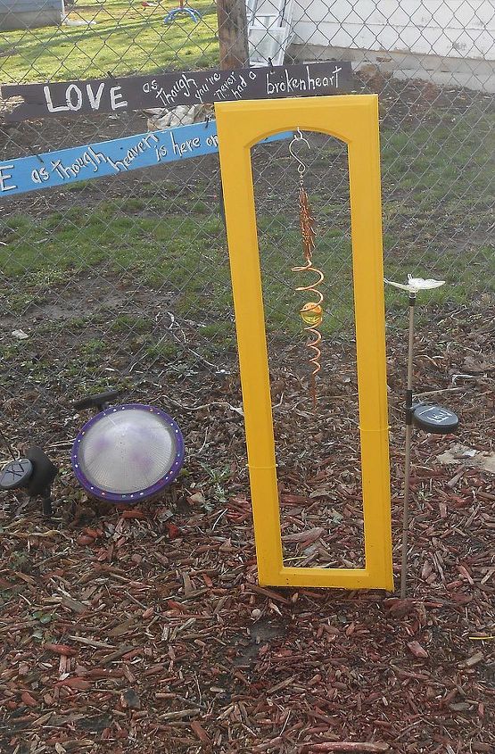 my repurposed garden, gardening, repurposing upcycling, Another door in yellow and the industrial lamp shade on the ground next to it is solar