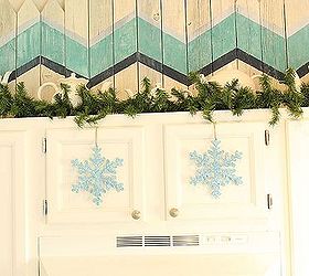 christmas decor in the kitchen, christmas decorations, kitchen design, seasonal holiday decor, Over sized ornaments hang easily to cupboard doors using upside down command hooks inside the door