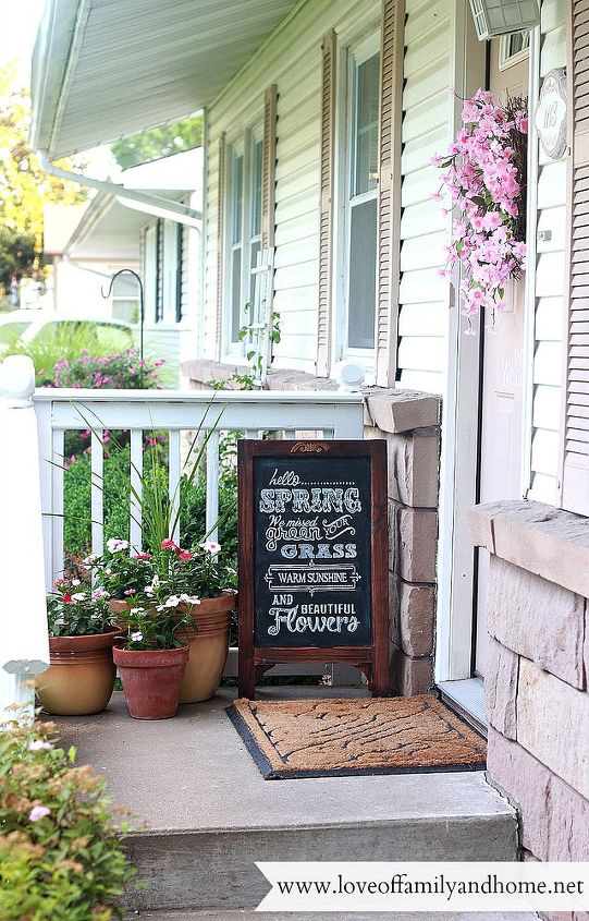 spring summer porch updates, chalkboard paint, crafts, curb appeal, seasonal holiday decor, wreaths, Instant character added with a new wreath potted flowers an easel chalkboard