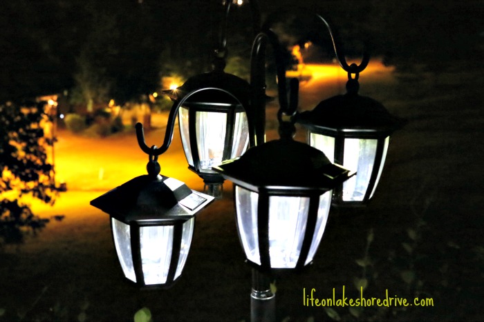 easy diy solar lights lamp post with flower planter, go green, landscape, lighting, outdoor living, It s amazing how much light they give off and the best part is so far they are not drawing bugs