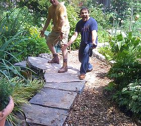 diy pond and slate project, diy, gardening, ponds water features, urban living, The slabs are like puzzle pieces coming together in a perfect fit to create an elegant path around our pond Matt and Aeli are pleased with their handiwork