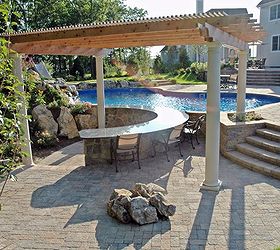 enjoying a tropical holiday every day, decks, outdoor living, patio, pool designs, Pool Side Bar This 32 foot U shaped swim up granite topped bar in cultured stone and rock facing curves around to be enjoyed from patio as well