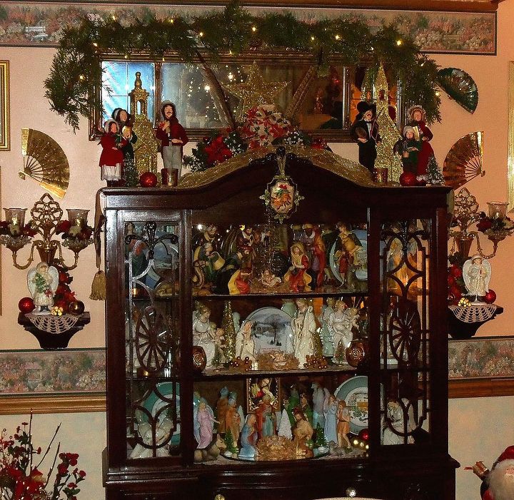 christmas home tour part 2 the living room, seasonal holiday d cor, 3 Nativity Sets displayed in an antique hutch