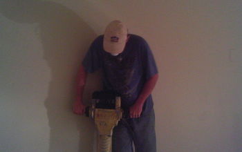 Hammer time!
Demo of a floor that was over laid on painted concrete. 
We found 2 layers of paint below the bad over lay.