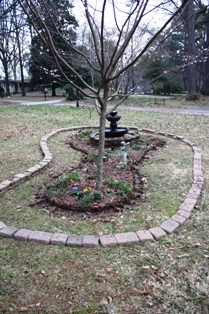 enlarging fountain flowerbed in front yard have scrapped gass and filled in since, gardening, outdoor living, Enlarging fountain flowerbed in front yard Have scrapped gass and filled in since photo was taken Hope to get planting ideas at the home show