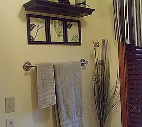 updating our master bathroom on the cheap, bathroom ideas, home decor, I coordinated framed paintings of the shower curtain with a floating ledge