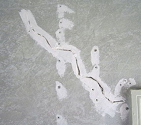 how to repair settling cracks in the drywall, Open up the crack edges with the point of a 5 in 1 tool to create a V shaped groove dust out and prime Screw down the springy wall to the closest studs