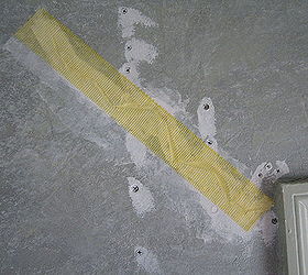 how to repair settling cracks in the drywall, Cover the crack with the low profile version of fiber tape