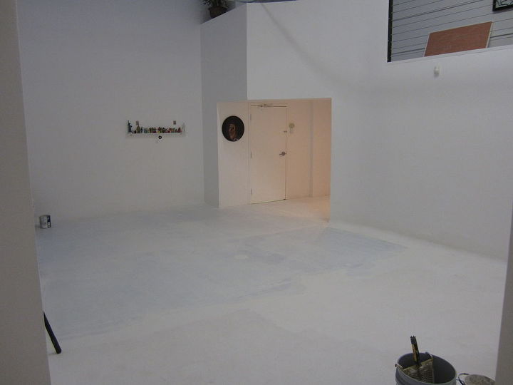 friend james wall called and said his art studio floor paint was peeling up we, flooring, painting, After confirming the concrete has porosity or profile enough to accept our paint we wet mop An additive called Emulsabond is used with the first coat on the bare darker areas