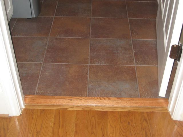 installing state tile flooring in laundry room, home decor, laundry rooms, tile flooring, tiling