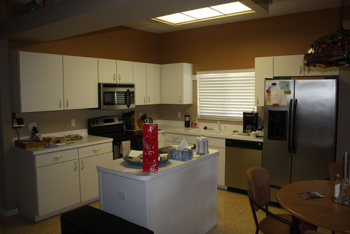 kitchen tune up refaced kitchen cabinets and added new cabinets above microwave and, home decor, kitchen backsplash, kitchen design, kitchen island, Before white laminate cabinets laminate countertop and florescent lighting