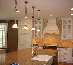 ak kitchen remodels, appliances, countertops, kitchen backsplash, kitchen cabinets, kitchen design, kitchen island, Furniture base toe kick shoe molding pilasters at range and sink and fillers per design and decorative hood wood top for window seat cabinets bead board on the back of the island end units were all built with custom cabinetry