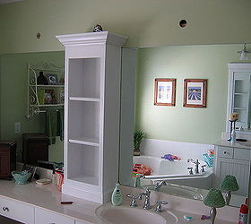 revamp that large bathroom mirror, Added shelving unit and attached to wall just above mirror to help anchor the weight