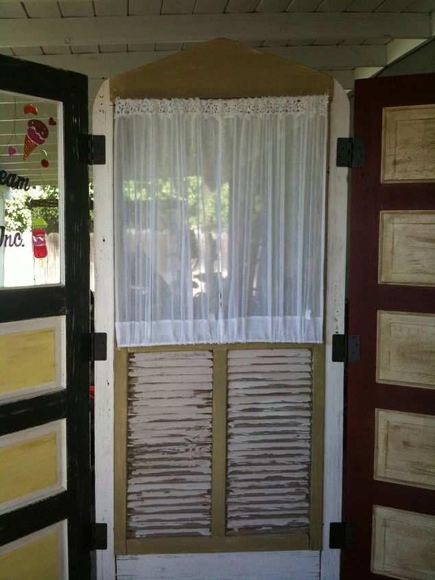 patio divider made from recycled doors, repurposing upcycling, old recycled doors made into patio divider