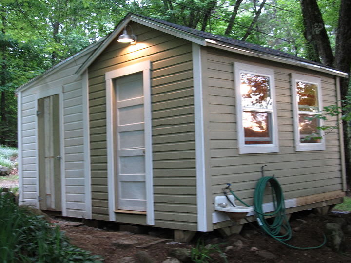 jacking up a shed, Added some single hung windows for a view of the pond Re fashioned an old door to fit