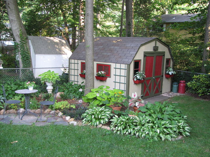 shed makeover, outdoor living, I decided I wanted something better Here is the result We added old windows to the front and window boxes