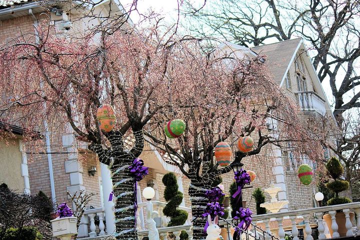 easter decoration for indoor and outdoor, easter decorations, gardening, seasonal holiday d cor, Giant papier mache Easter Eggs making a papier mache is bit complicated but there is a simple way to create your giant eggs with your own style by simply grabbing a bunch of loose leaf papers and crumpling them up into balls Tie all the balls together by wrapping tape around them Finally take large colorful wrapping paper or create your own design with craft paper then wrap the balls Fun ribbons and bows will add something special