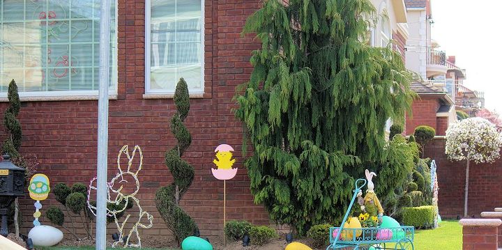 A Scene of Easter Celebration -What's cuter than a bunny hiding behind a shrub? Not much else! Find your nearest craft store (such as Michaels, AC Moore or some local pharmacy) and look for a medium sized bunny decoration, (we don't want it to get lost behind the large shrub). Find additional decorations such as colorful Easter eggs made out of ribbon (use a metal wire and wrap with the colorful ribbon) or small plastic Easter eggs. The combination makes for an adorable scenery!