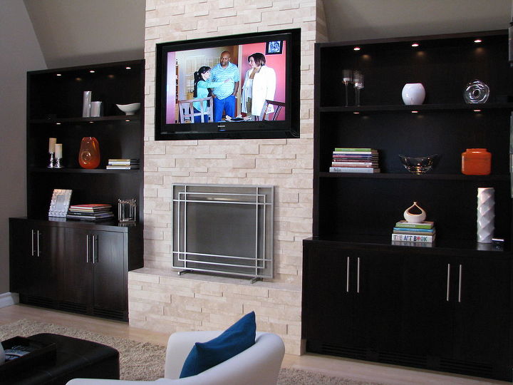 stacked stone fireplace make over, fireplaces mantels, home decor, living room ideas, You can see that Lisa LaPorta from HGTV is right at home on our new built in TV