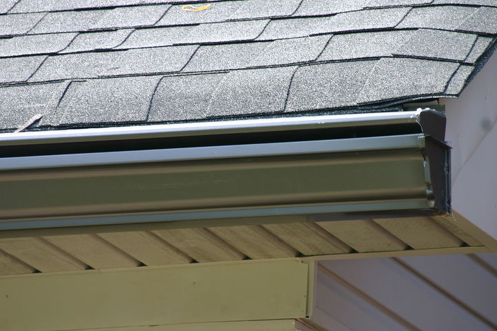 ideally gutters should be cleaned once each quarter to avoid water backing up from, curb appeal, home maintenance repairs, roofing, EverClean covered gutter system