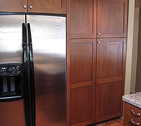 does it work to reface cabinets or should you start over with a complete kitchen, home decor, kitchen design, Another attractive feature of this kitchen remodel included creating this built in look for the refrigerator and the unified look of the refurbished pantry