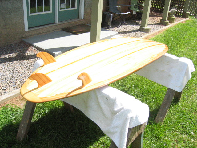 finished another surfboard for my son in ca have started a full size canoe, woodworking projects, Triple fin with channeled bottom Oh Yeah