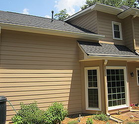 gutter downspouts contrast or blend, Pick a place on the downspout elbow to match the sight line of the siding